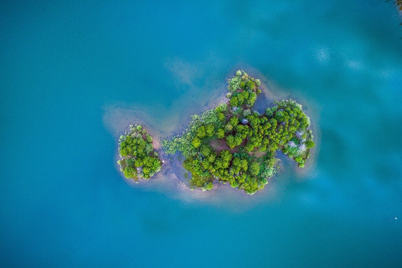 Drone picture of a small, green island